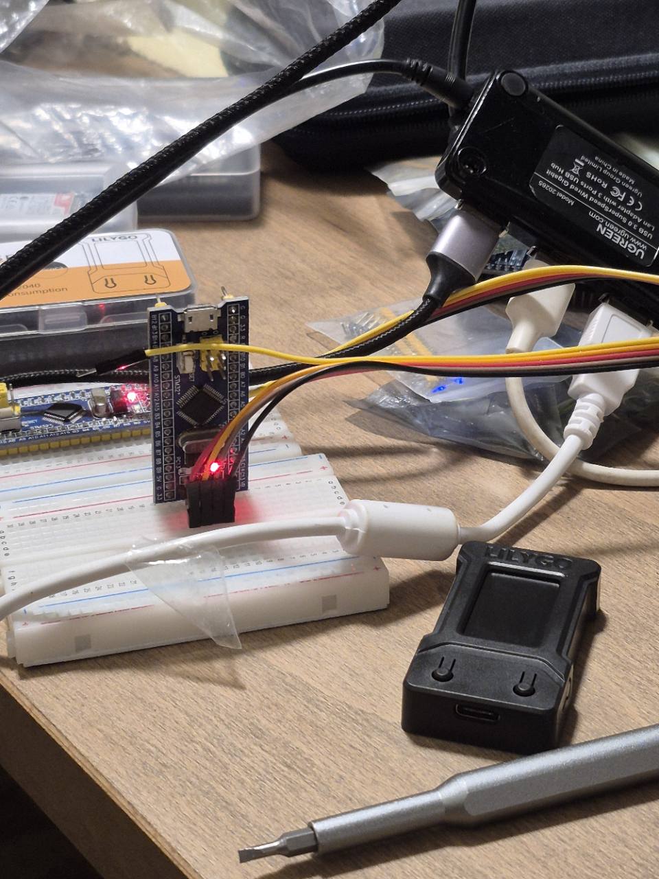 Blue Pill boards and jumper wires on a breadboard during the LED test